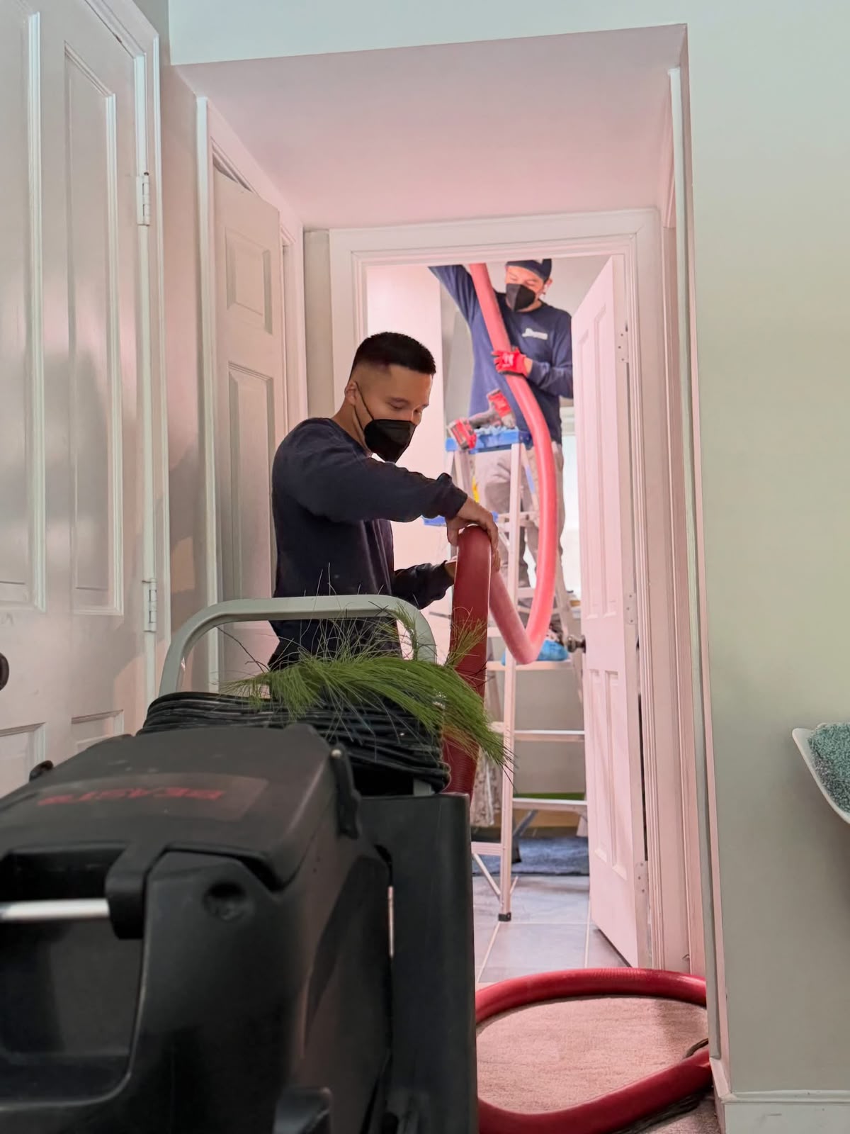Pristine technician performing air duct cleaning