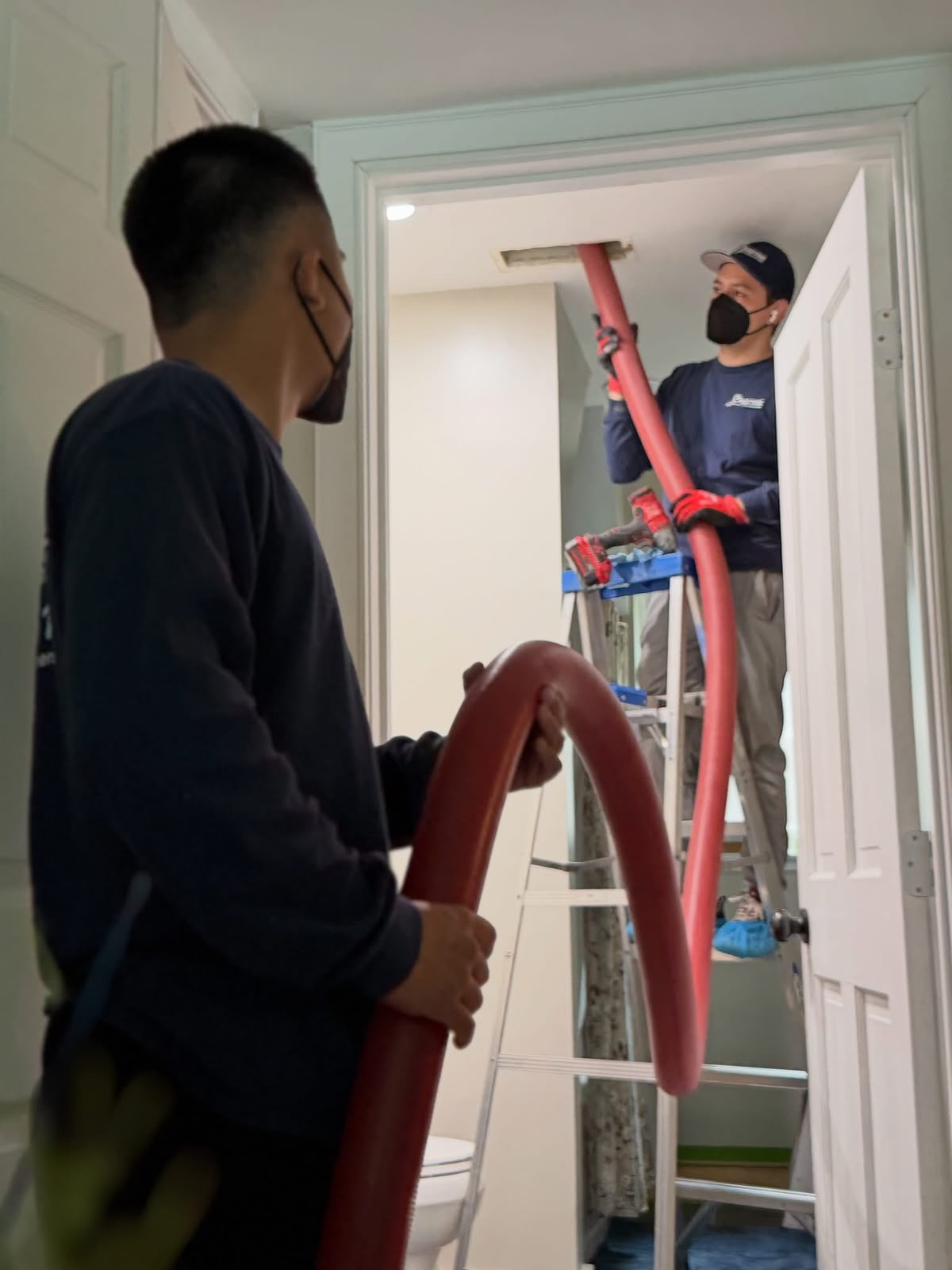 Pristine technician using professional air duct cleaning equipment